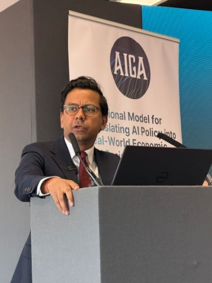 A speaker addresses attendees at the AI Growth Alliance launch, Farnborough International Airshow.